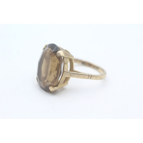 64 - 9ct gold smoky quartz cocktail ring (6.1g) Size N 1/2