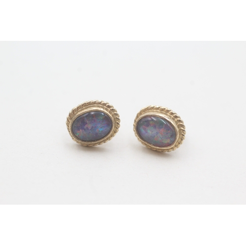 67 - 9ct gold opal triplet stud earrings (2.1g)