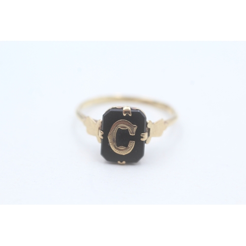 76 - 9ct rose gold onyx set gothic 