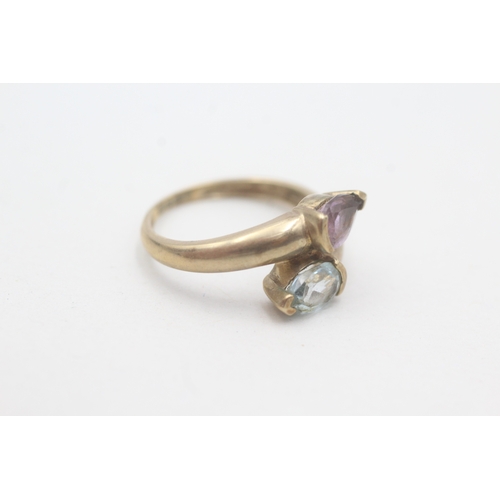 78 - 9ct gold topaz and amethyst twin stone ring (2.3g) Size N