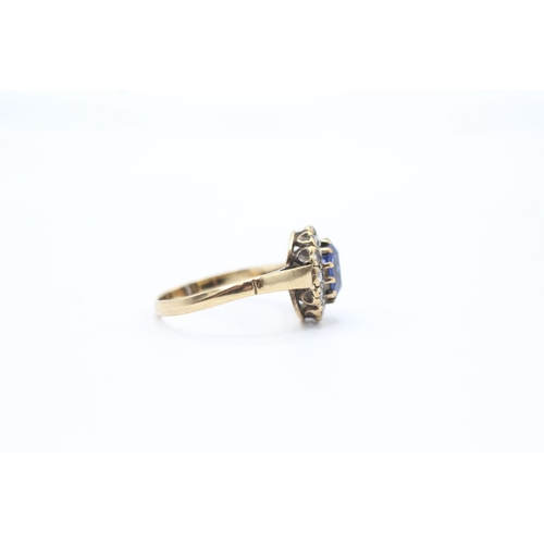 94 - 9ct gold synthetic sapphire & synthetic spinel oval halo ring (2.2g) Size M