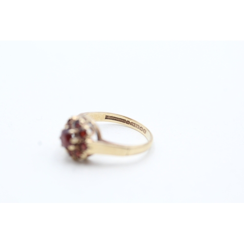 101 - 9ct gold garnet halo ring (2g) Size I 1/2