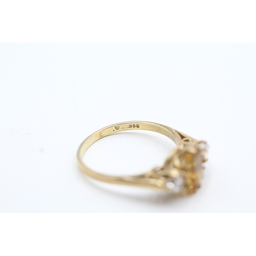 105 - 9ct gold citrine and white gemstone trilogy ring (2.5g) Size P