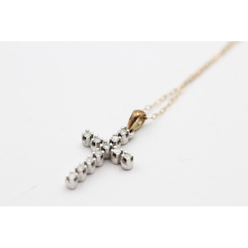 107 - 9ct gold diamond cross pendant on chain (1.4g)