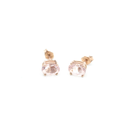 108 - 9ct gold oval cut pink gemstone stud earrings (1.2g)