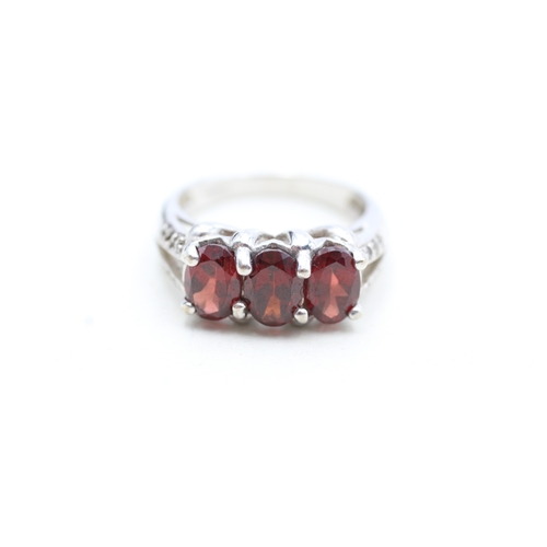 12 - 9ct white gold garnet and white gemstone set dress ring (4.8g) Size N