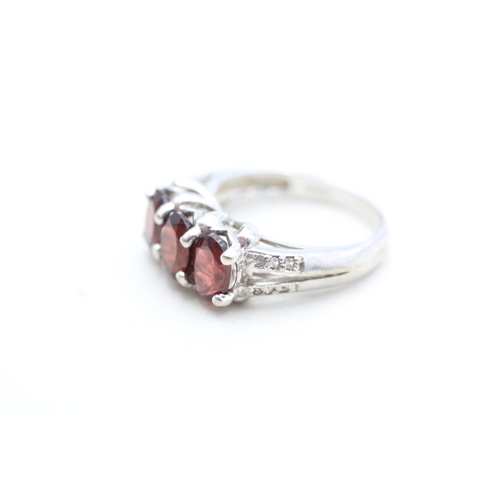 12 - 9ct white gold garnet and white gemstone set dress ring (4.8g) Size N