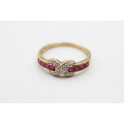 128 - 9ct gold ruby and diamond cross channel ring (1.9g) Size P 1/2