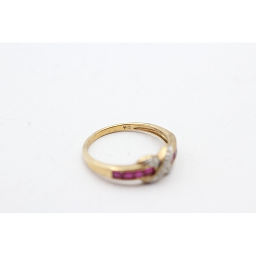 128 - 9ct gold ruby and diamond cross channel ring (1.9g) Size P 1/2