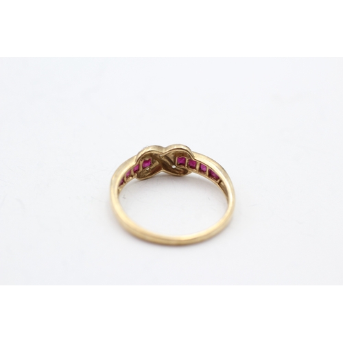 128 - 9ct gold ruby and diamond cross channel ring (1.9g) Size P 1/2