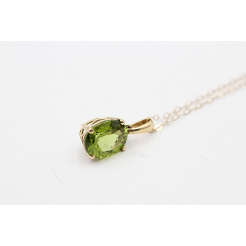 137 - 9ct gold oval cut peridot pendant necklace (1.7g)