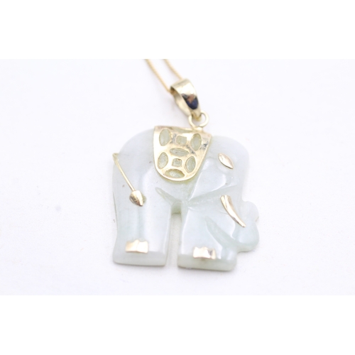 142 - 9ct gold carved jade elephant pendant necklace (3.9g)