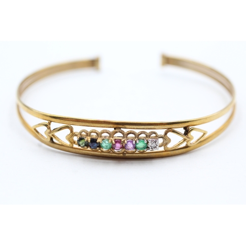 15 - 9ct gold diamond, emerald, amethyst, ruby, sapphire and tourmaline 'dearest' bangle (5.1g)