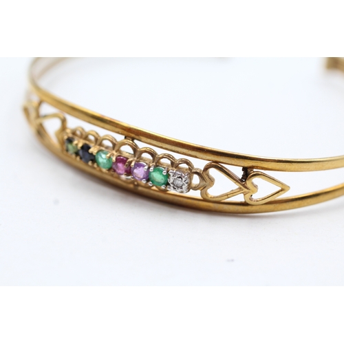 15 - 9ct gold diamond, emerald, amethyst, ruby, sapphire and tourmaline 'dearest' bangle (5.1g)