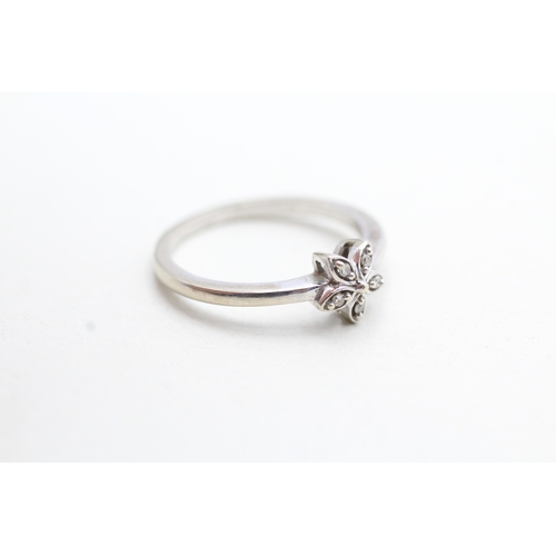 151 - 9ct white gold diamond set floral dress ring (1.9g) Size M