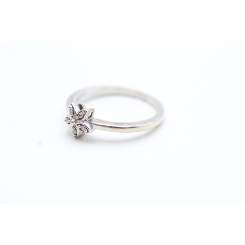 151 - 9ct white gold diamond set floral dress ring (1.9g) Size M