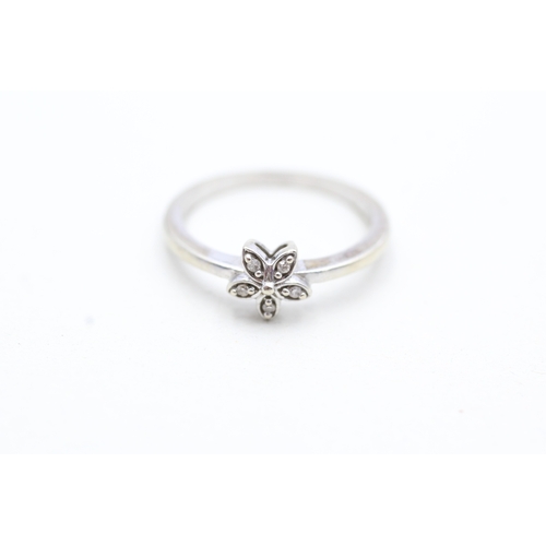 151 - 9ct white gold diamond set floral dress ring (1.9g) Size M