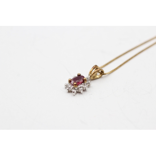 155 - 9ct gold ruby and diamond halo pendant on chain (1.3g)