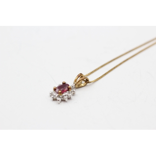 155 - 9ct gold ruby and diamond halo pendant on chain (1.3g)