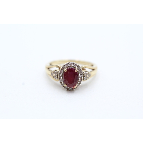 157 - 9ct gold diamond and enhanced ruby halo ring (2.2g) Size K 1/2