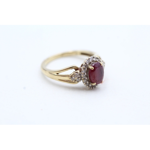 157 - 9ct gold diamond and enhanced ruby halo ring (2.2g) Size K 1/2