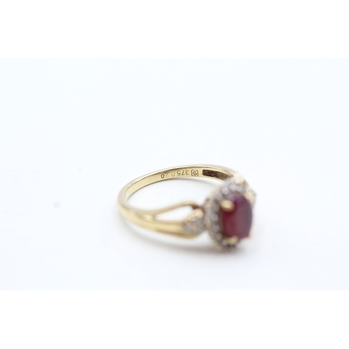 157 - 9ct gold diamond and enhanced ruby halo ring (2.2g) Size K 1/2