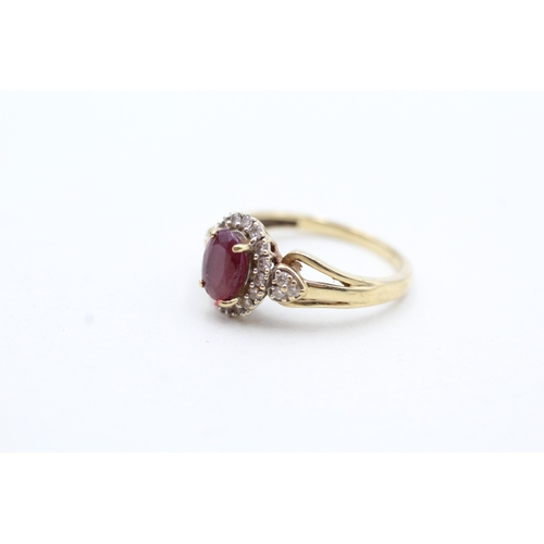 157 - 9ct gold diamond and enhanced ruby halo ring (2.2g) Size K 1/2