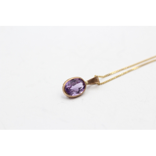 167 - 9ct gold amethyst single stone pendant on chain (1.2g)