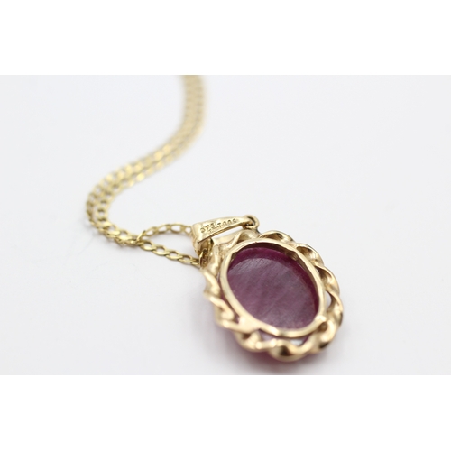 189 - 9ct gold ruby pendant on chain (4.2g)