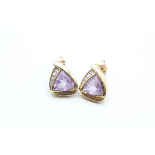 192 - 9ct gold trilliant cut amethyst and diamond set stud earrings (2.7g)