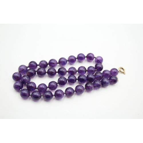 196 - 9ct gold amethyst beaded necklace (53.2g)