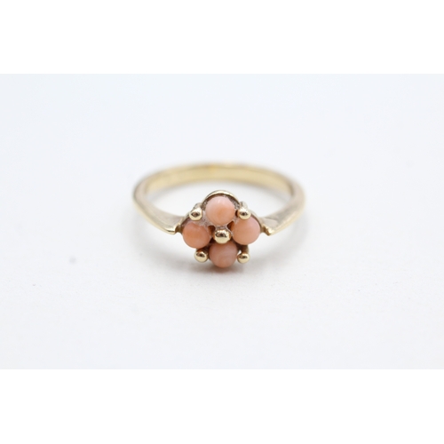 198 - 9ct gold coral four stone dress ring (2g) Size J