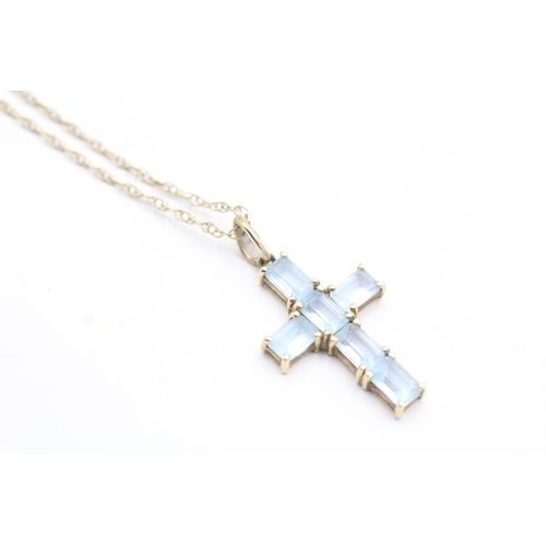 201 - 9ct gold topaz cross pendant on chain (3.6g)