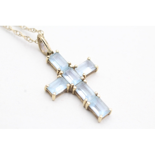 201 - 9ct gold topaz cross pendant on chain (3.6g)