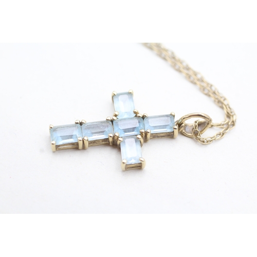 201 - 9ct gold topaz cross pendant on chain (3.6g)