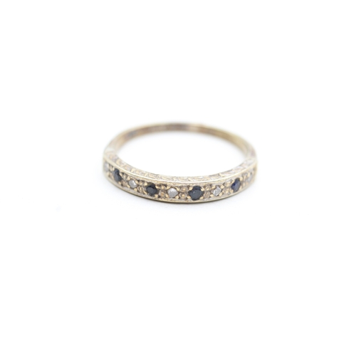 213 - 9ct gold diamond and sapphire set eternity ring (2.6g) Size R