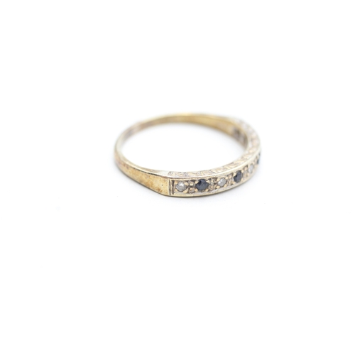 213 - 9ct gold diamond and sapphire set eternity ring (2.6g) Size R