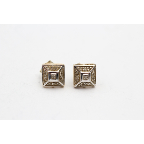 214 - 9ct gold diamond stud earrings (1.4g)