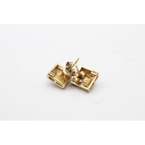 214 - 9ct gold diamond stud earrings (1.4g)