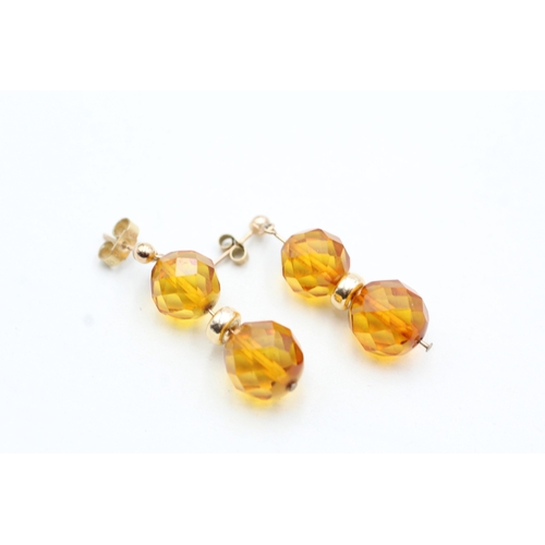 216 - 9ct gold faceted amber bead drop earrings (2.7g)