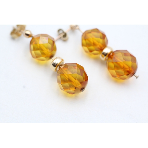 216 - 9ct gold faceted amber bead drop earrings (2.7g)