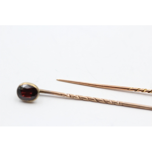 218 - 2x 9ct gold vintage vari-cut garnet stick pin (3.6g)