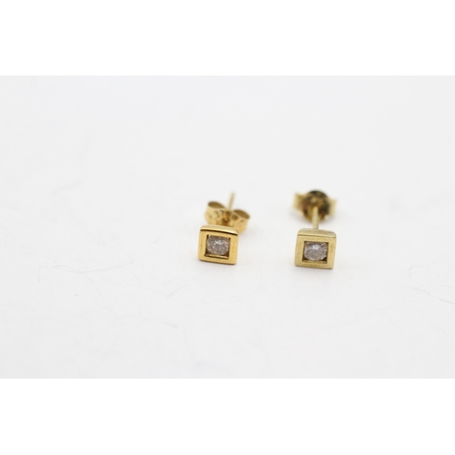 231 - 9ct gold diamond single stone stud earrings (0.5g)