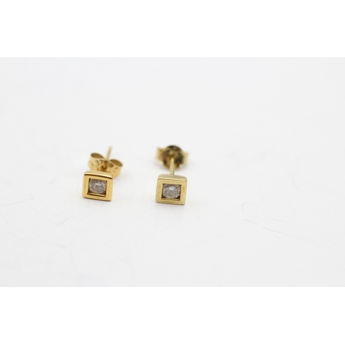 231 - 9ct gold diamond single stone stud earrings (0.5g)