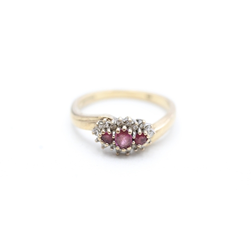 233 - 9ct gold ruby & diamond dress ring (2.9g) Size N