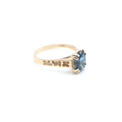 235 - 9ct gold blue topaz set dress ring (2.7g) Size O