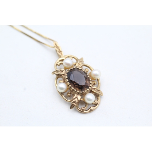 242 - 9ct gold smokey quartz and cultured pearl pendant on chain (3g)