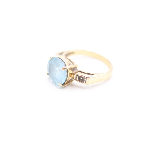 244 - 9ct gold blue and white gemstone set dress ring (4.1g) Size N