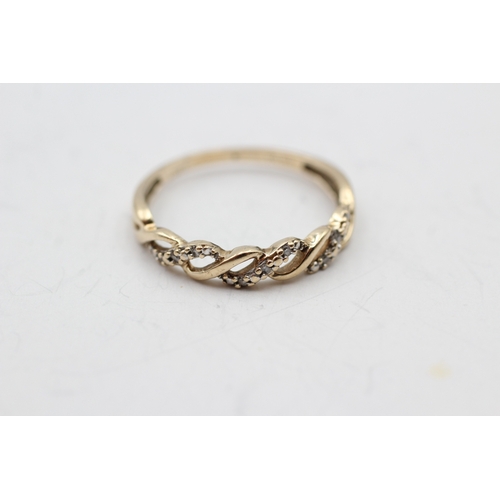 35 - 9ct gold diamond twist ring (1.7g) Size R