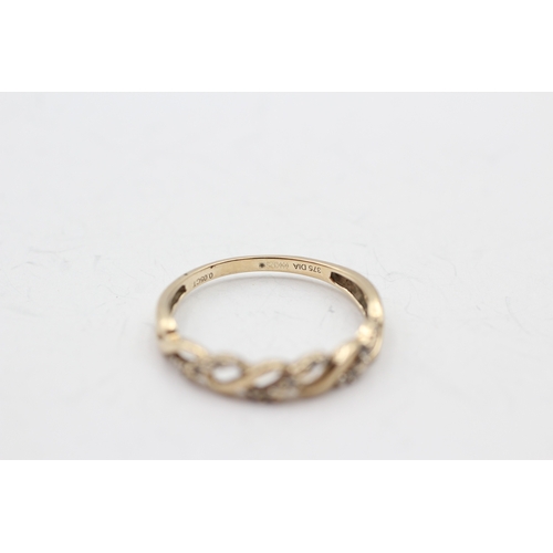 35 - 9ct gold diamond twist ring (1.7g) Size R